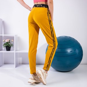 Жовті жіночі спортивні штани з лампасами